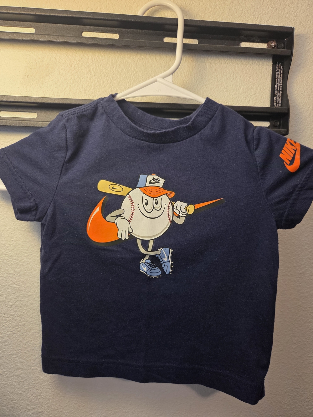 Kids Nike Navy Tee with Orange Baseball Graphic